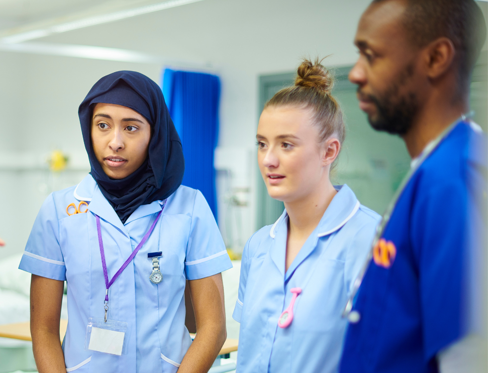 a mixture of two international nurses, one who is a muslim nurse and the other who is a african male nurse