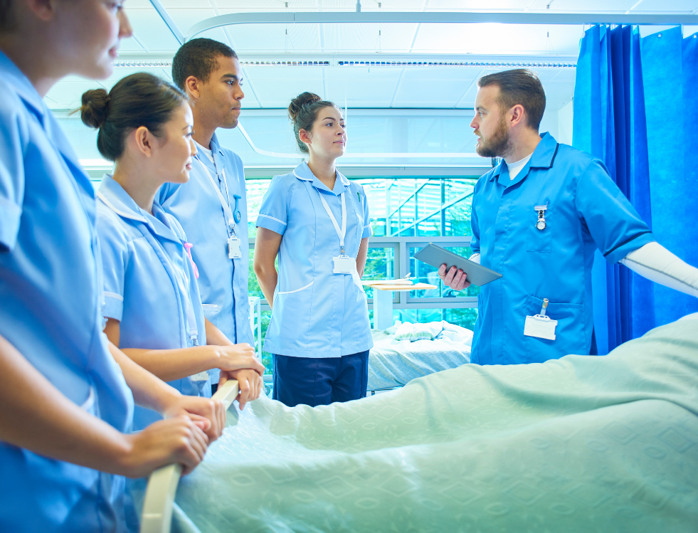 a group of nurses working in a hospital that work for concept care recruitment