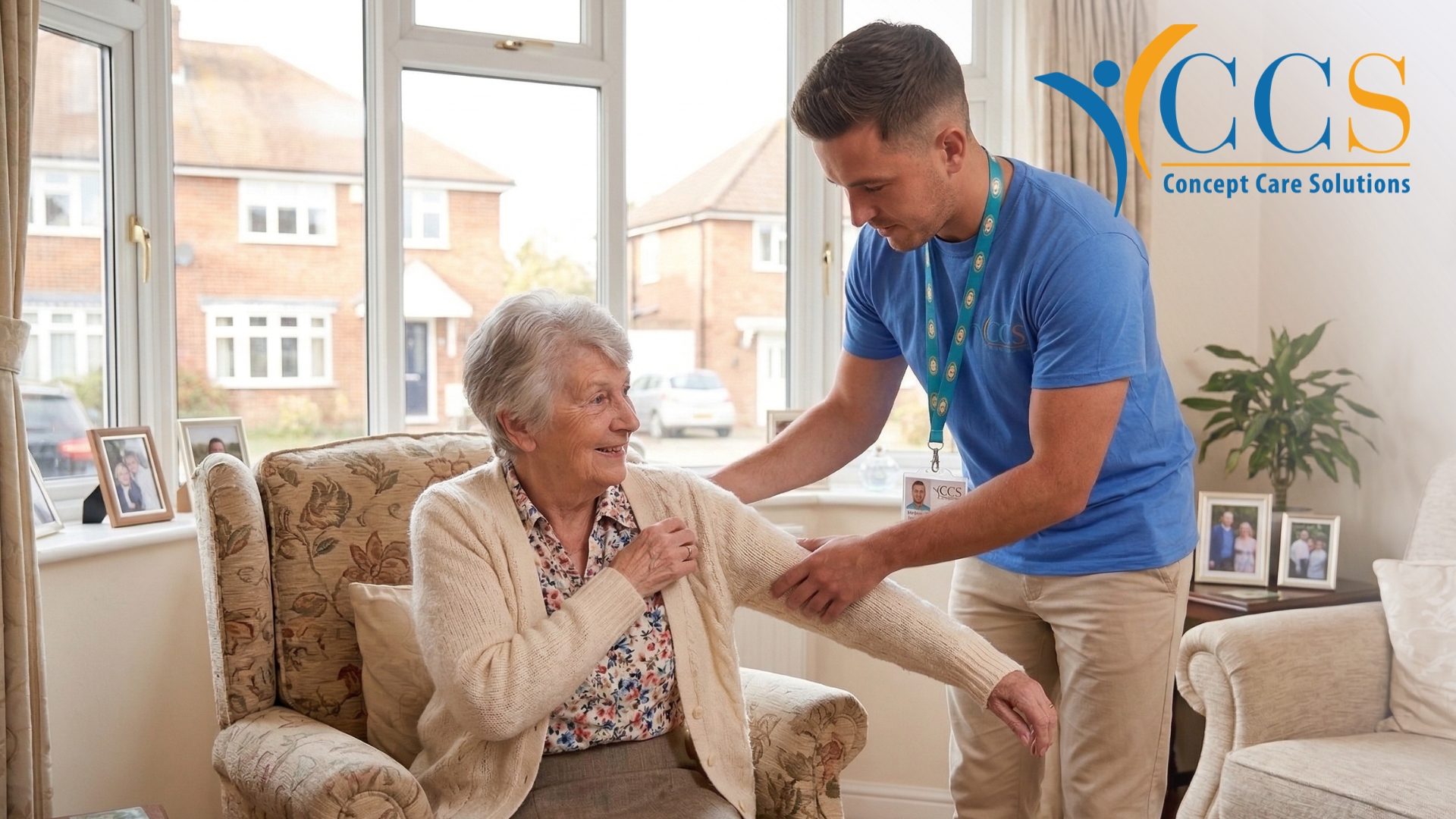 Unpaid carer supporting elderly woman at home in the UK helping with daily care